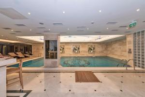 a large swimming pool in a hotel room at Piya Sport Hotel in Istanbul