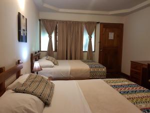 Postelja oz. postelje v sobi nastanitve Hotel Dos Rios