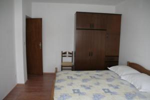 Postel nebo postele na pokoji v ubytování Apartmani Huljev