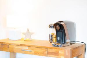 a toaster sitting on top of a wooden table at Apartment Buchsteiner in Haus im Ennstal