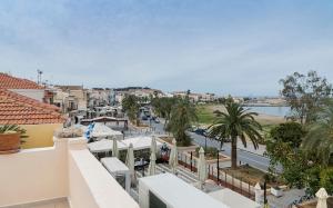 a view of a city from the balcony of a building at Elois Suites in Rethymno Town