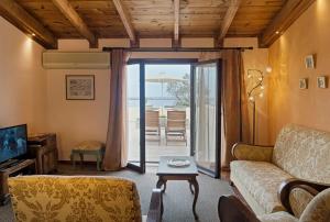 a living room with a couch and a table at Elois Suites in Rethymno Town