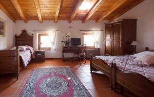 Rúm í herbergi á Agriturismo I Comelli