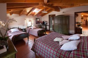 Säng eller sängar i ett rum på Agriturismo I Comelli