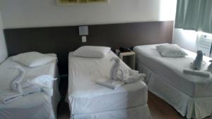 Cama ou camas em um quarto em Excellence Comfort Hotel