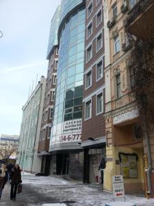 a group of buildings with people walking in front of them at Mini ELEGANT in Kyiv