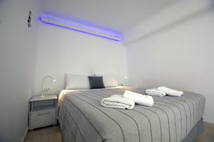 Postel nebo postele na pokoji v ubytování Amarain Mykonos
