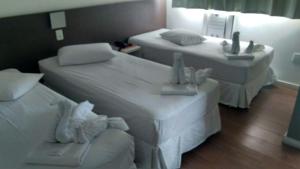 Cama ou camas em um quarto em Excellence Comfort Hotel