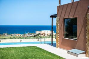 a villa with a view of the ocean at Villa Kudos in Maleme