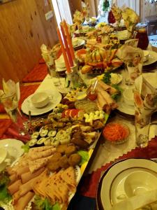 a long table with many different types of food at Eco Boutique Guest House Celmalas in Aglona
