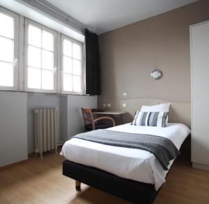 Postel nebo postele na pokoji v ubytování Hotel La Royale