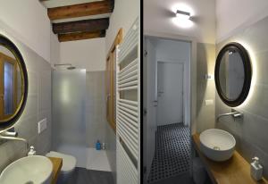 a bathroom with two sinks and a mirror at Carbonaia Venezia in Venice