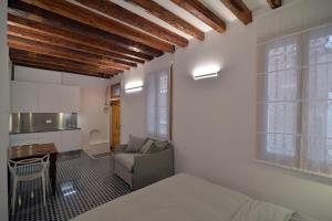 Un pat sau paturi într-o cameră la Carbonaia Venezia