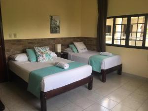Postel nebo postele na pokoji v ubytování Hotel Tuparenda + 37 fotografií