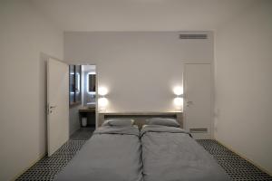 Postel nebo postele na pokoji v ubytování Carbonaia Venezia