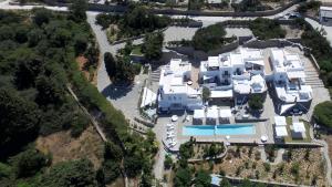 an aerial view of a large white house with a swimming pool at Paros Butterfly Villas in Pounda