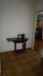 a sewing machine sitting on a wooden table in a room at Casa Reis in Santana