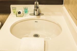 Koupelna v ubytování Le Chabrol Hotel & Suites