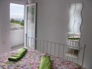 Postel nebo postele na pokoji v ubytování Apartmani Vukmanovic