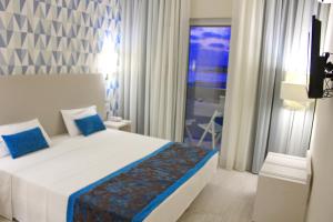 A bed or beds in a room at Ouril Hotel Agueda