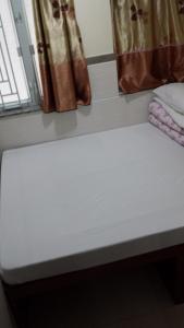 Cama o camas de una habitación en E-Dragon Hotel 一龙酒店