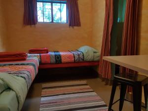 Posteľ alebo postele v izbe v ubytovaní The Cell Block Backpackers