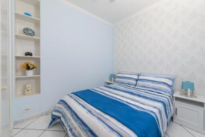 A bed or beds in a room at ALDO'S HOLIDAY HOUSE