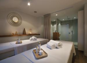 Postel nebo postele na pokoji v ubytování Petit Hôtel Confidentiel