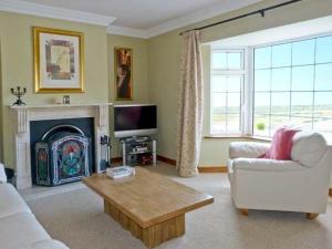a living room with a couch and a coffee table at Carraig Oisin in Waterville