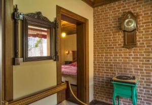 A bed or beds in a room at Elaia Hotel