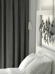 Postel nebo postele na pokoji v ubytování IONIAN SUITES by Bruskos