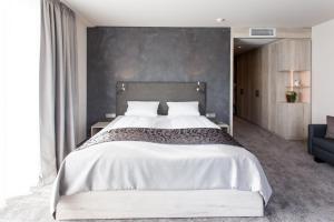 Postel nebo postele na pokoji v ubytování monte mare SAUNA-SPA-SPORTS-HOTEL