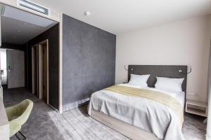 Postel nebo postele na pokoji v ubytování monte mare SAUNA-SPA-SPORTS-HOTEL
