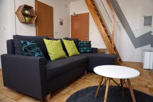 a living room with a couch and a table at Krona Apartments in Bovec