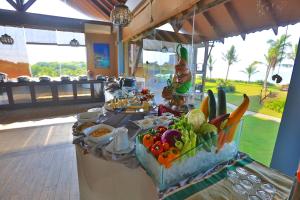 a buffet with vegetables on a table in a restaurant at Laya Safari Resorts & Spa in Yala
