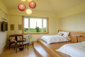 Postel nebo postele na pokoji v ubytování Ming Shui Lu Homestay