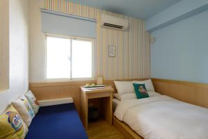 Postel nebo postele na pokoji v ubytování Ming Shui Lu Homestay