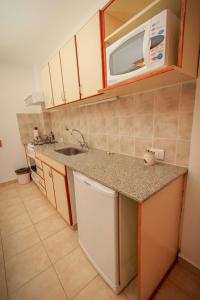 Una cocina o kitchenette en Melewe Apart hotel Caviahue