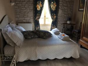 Postel nebo postele na pokoji v ubytování Chambre d'hotes la Quercynoise