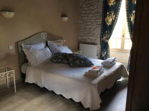 Letto o letti in una camera di Chambre d'hotes la Quercynoise