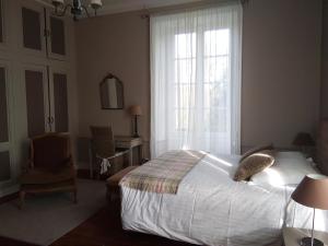 Llit o llits en una habitació de Le Domaine Du Cormier