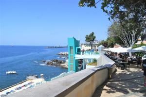 a view of a body of water with a beach at Casa da Avó Irene in Funchal