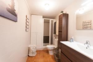 a bathroom with a sink and a toilet at Lets Holidays RENOVATED APARTMENT NEAR BEACH in Tossa de Mar