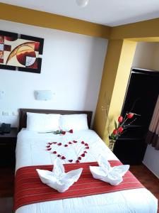 Postel nebo postele na pokoji v ubytování Pumas Cusco Hotel