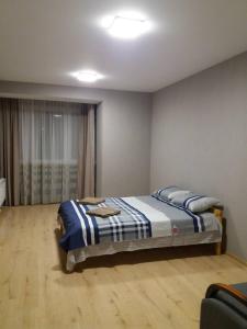 Postel nebo postele na pokoji v ubytování 2-х кім. кв. по вул. Кн. Ольги, р-н Вікторія Гарден.