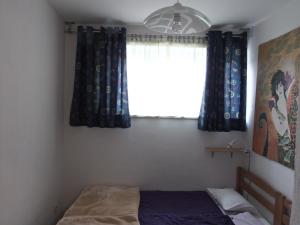 Posteľ alebo postele v izbe v ubytovaní Apartman L&P