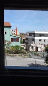 a view from a window of a street with buildings at Apartment Buic in Pula