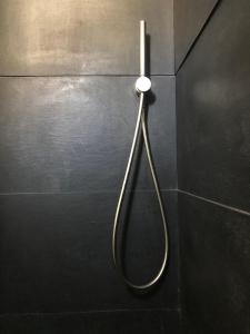 a metal shower head hanging on a wall at Casalmare in Cefalù