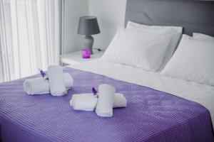 Postel nebo postele na pokoji v ubytování Sea Breeze Boutique