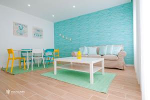 a living room with a couch and a table at Iris Apartment in Nazaré